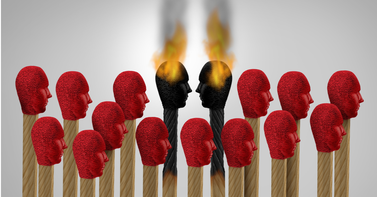 Picture of multiple match heads and two in the middle have ignited